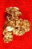 Alaska Gold Nugget Shaped Like a Man Carrying a ??